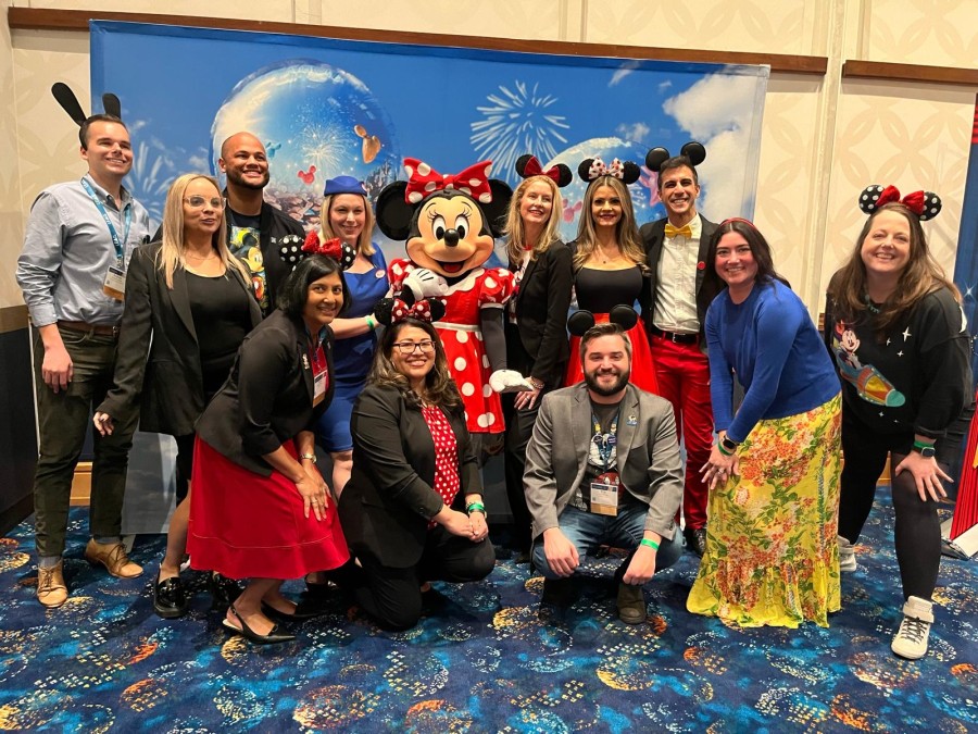 The CASE DVII/DVIII conference planning committee enjoys time with Disney friends during the conference in March 2024.