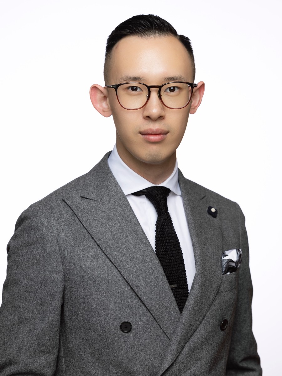 Headshot of Ziqiao Chen, a man wearing a suit and glasses.